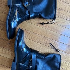 Stuart Weitzman black shiny rain boots. Well lined to keep you warm and dry